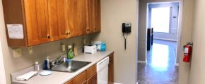 Kitchenette with sink, dishwasher, and cabinets