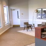 Reception area with front desk, coffee station, and seating