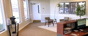 Reception area with front desk, coffee station, and seating