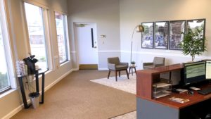 Reception area with front desk, coffee station, and seating