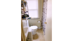 Bathroom with sink, toilet, and tub/shower combo