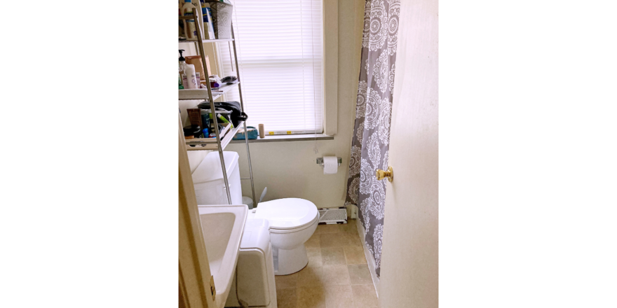 Bathroom with sink, toilet, and tub/shower combo