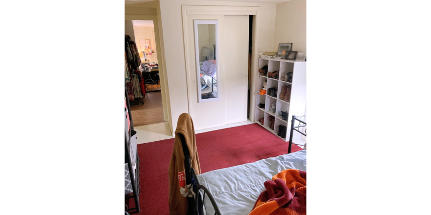 Bedroom with area rug and furniture
