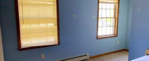 Bedroom with windows and bed