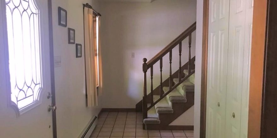 Entryway with stairwell and closet