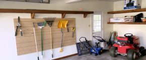 Garage with shelving and gardening equipment
