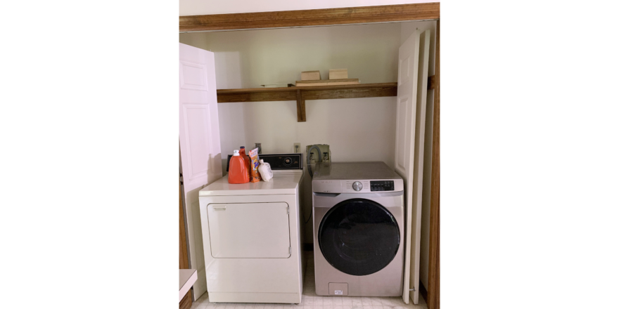 Laundry closet with washer and dryer