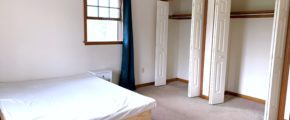 Bedroom with bed and closets
