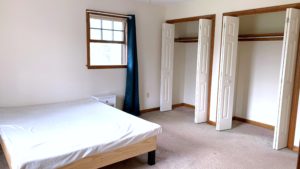 Bedroom with bed and closets