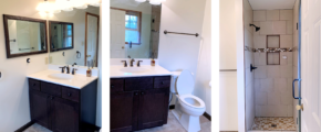 Bathroom with shower stall, vanity, toilet, and mirrors