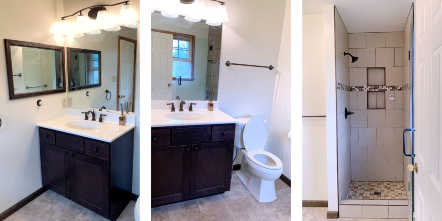 Bathroom with shower stall, vanity, toilet, and mirrors