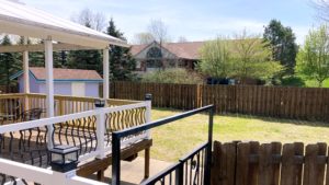 Yard with storage shed and large deck