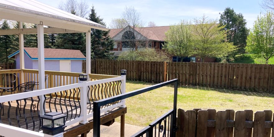 Yard with storage shed and large deck