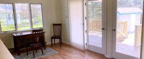 a dining room table and chairs in front of a sliding glass door