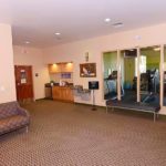 Common area with bench, couch, and water fountains