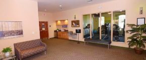 Common area with bench, couch, and water fountains