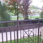 Balcony with railing and patio chair