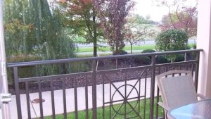 Balcony with railing and patio chair