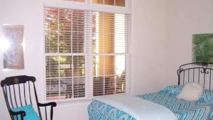 Bedroom with bed and rocking chair