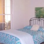 Bedroom with bed, nightstand and lamp