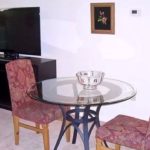 Table with two chairs and a bowl