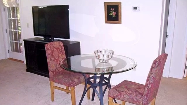 Table with two chairs and a bowl
