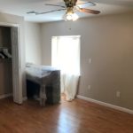 Bedroom with closet, piano, and egress window