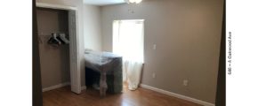 Bedroom with closet, piano, and egress window