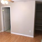 Bedroom with built-in shelving