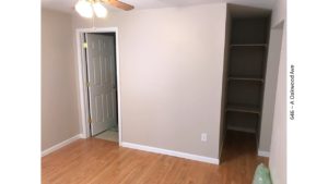 Bedroom with built-in shelving
