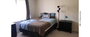 Bedroom with bed, nightstand, and lamps