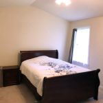 Bedroom with bed, nightstand and lamp