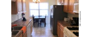 Kitchen with cabinets, appliances, and table