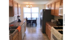 Kitchen with cabinets, appliances, and table