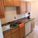 Kitchen with sink, table, and dishwasher