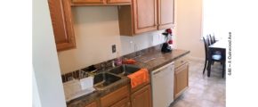 Kitchen with sink, table, and dishwasher