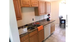 Kitchen with sink, table, and dishwasher