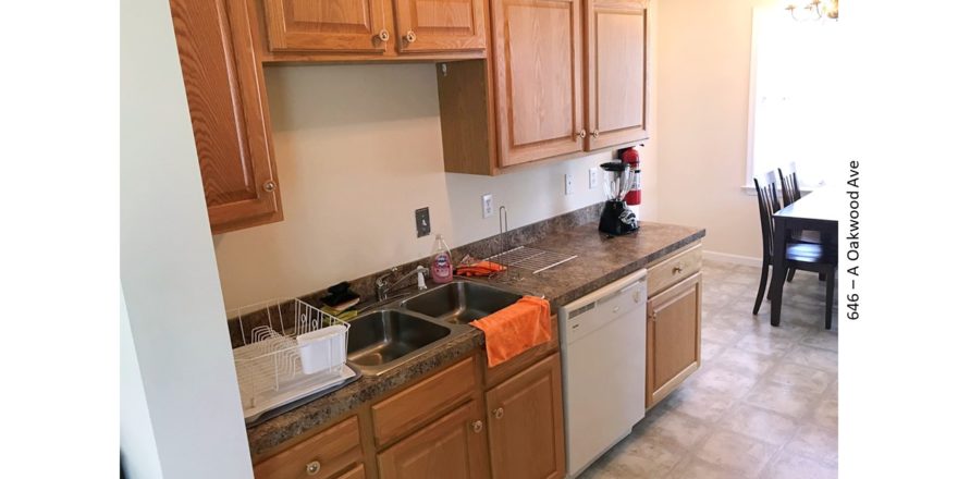 Kitchen with sink, table, and dishwasher