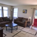 Furnished living room with door to a deck