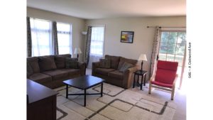 Furnished living room with door to a deck