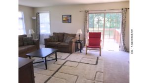 Furnished living room with door to a deck