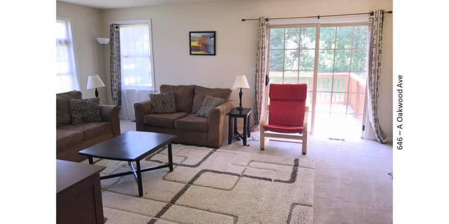 Furnished living room with door to a deck