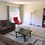 Furnished living room with door to a deck