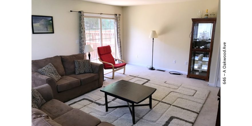 Furnished living room with door to a deck