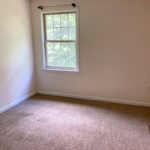 Carpeted, unfurnished bedroom