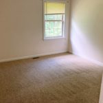 Carpeted, unfurnished bedroom
