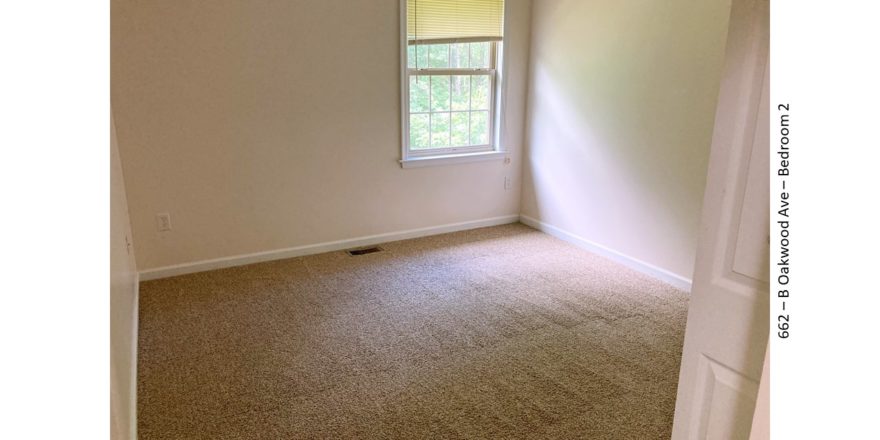 Carpeted, unfurnished bedroom