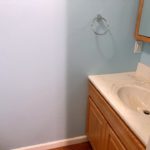 Vanity, medicine cabinet, and towel rack