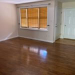 Living room with wood-style flooring and large window