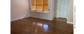 Living room with wood-style flooring and large window